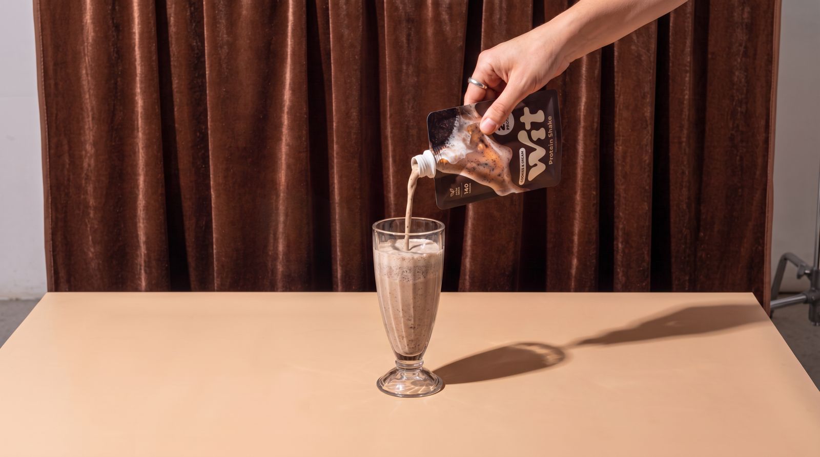 WIT protein shake being poured
